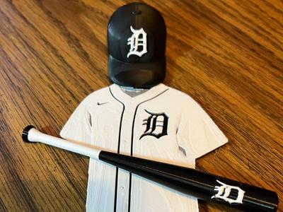 Detroit Tigers baseball gear hat, jersey, and bat
