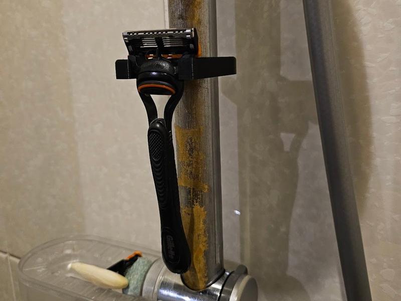 Razor attachment shower rod