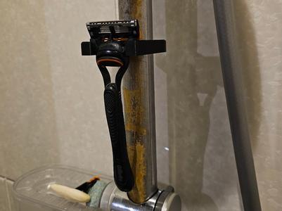 Razor attachment shower rod