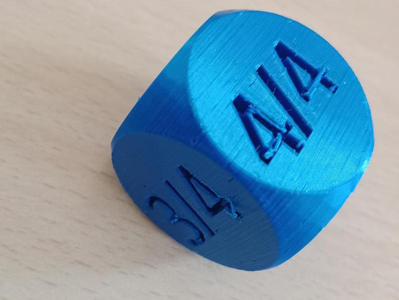 Kostka pro náhodné určení taktu do hudební výchovy.