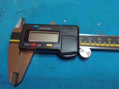 Battery cover for digital caliper