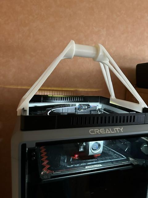 K1 Max top mounted filament spool holder modded to use vented raiser from NorcoT