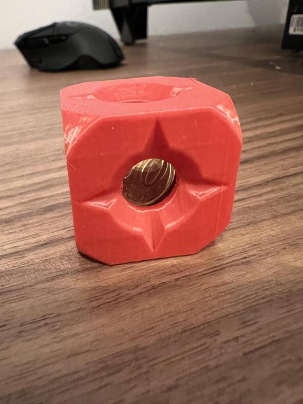 A coin stuck in a cube
