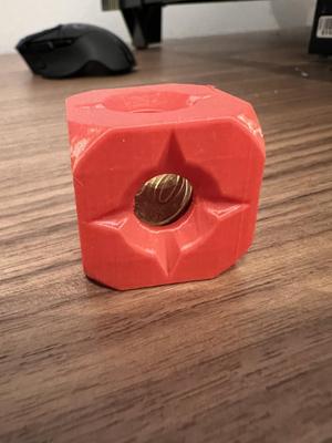 A coin stuck in a cube