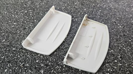Handle plate for freezer compartment flap