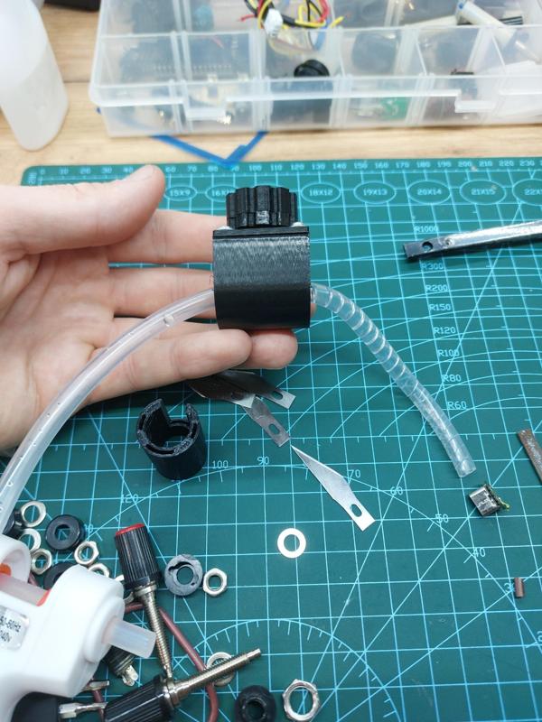 A machine for cutting spiral binding for wire, from a hose