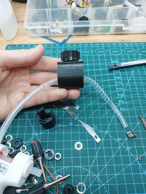 A machine for cutting spiral binding for wire, from a hose
