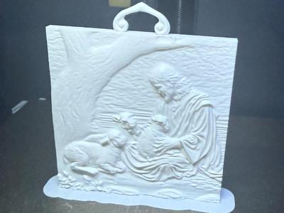 Jesus holding a lamb under tree
