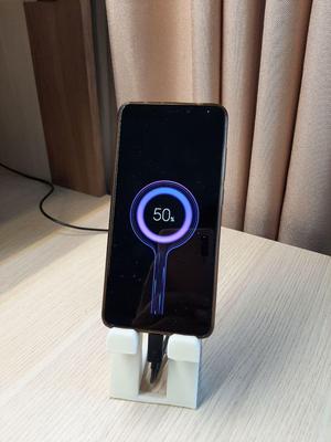 Phone holder with charging hole