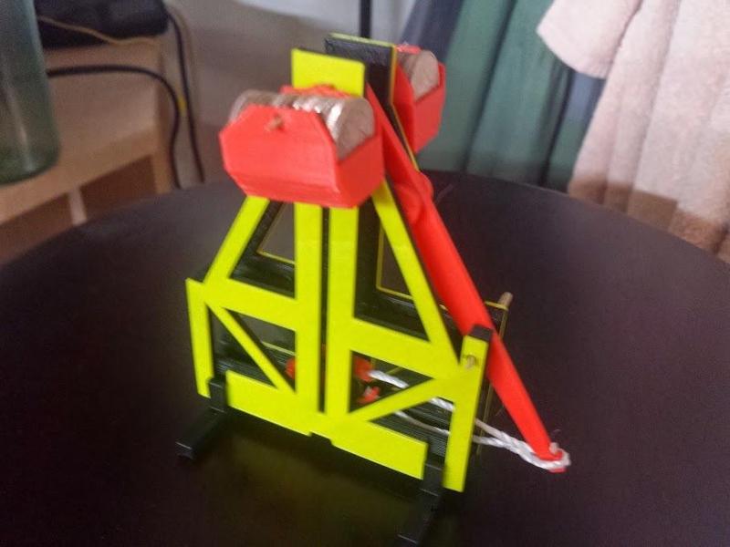 Floating arm trebuchet (dimes and pennies)