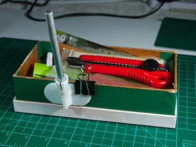 Xacto holder for desk use