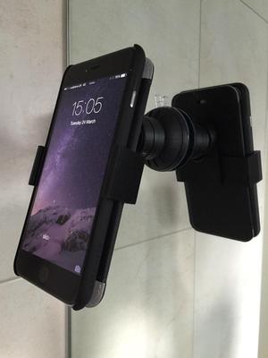 Cased iPhone 6 Plus car mount adapter.