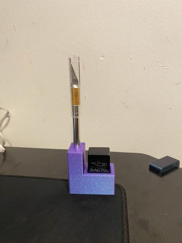 Xacto knife + blade holder mount for honeycomb wall