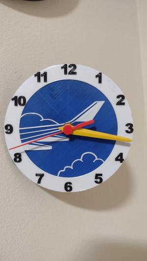 Reloj cola avión
