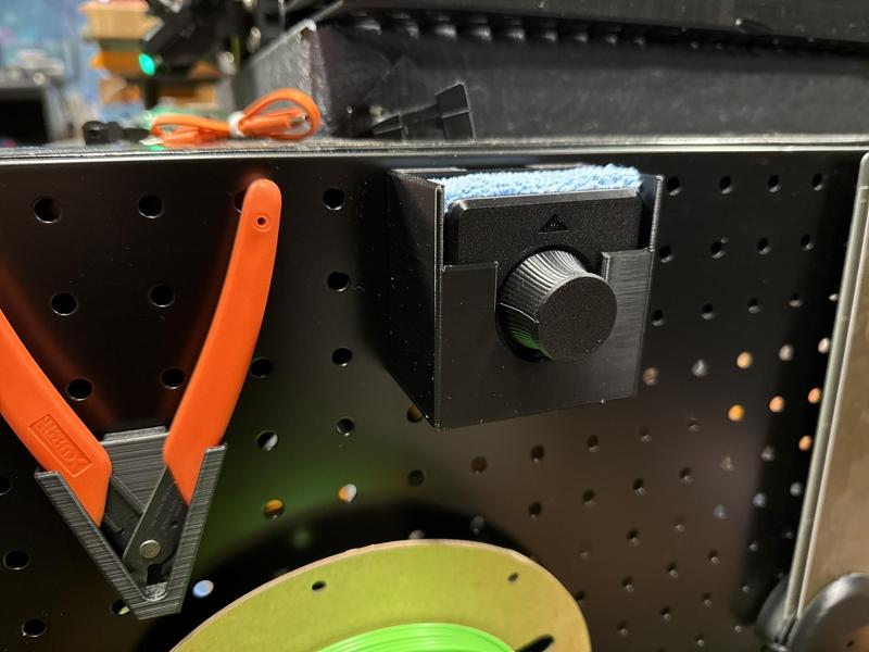 Peglock pegboard mount for bed plate cleaner