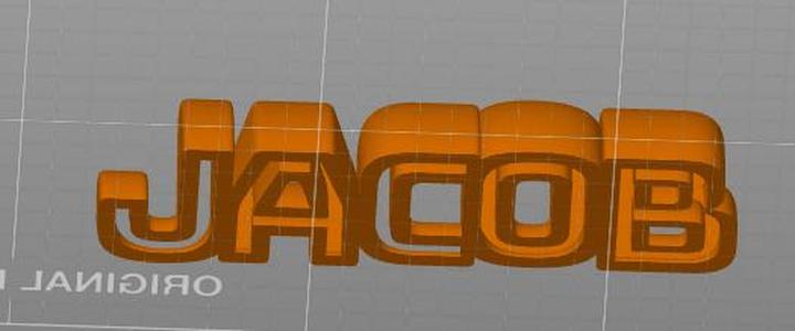 Office desk sign for someone named Jacob