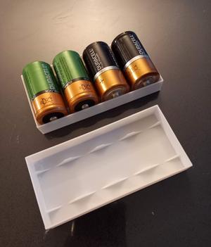 Storage compartment for C batteries or similar (LR14, MN1400, ...)