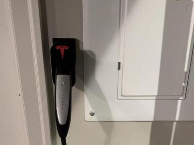 Tesla charging cable holder