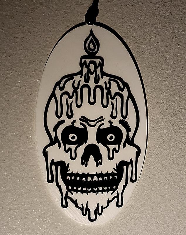Melting Skull plaque with pinhole on top