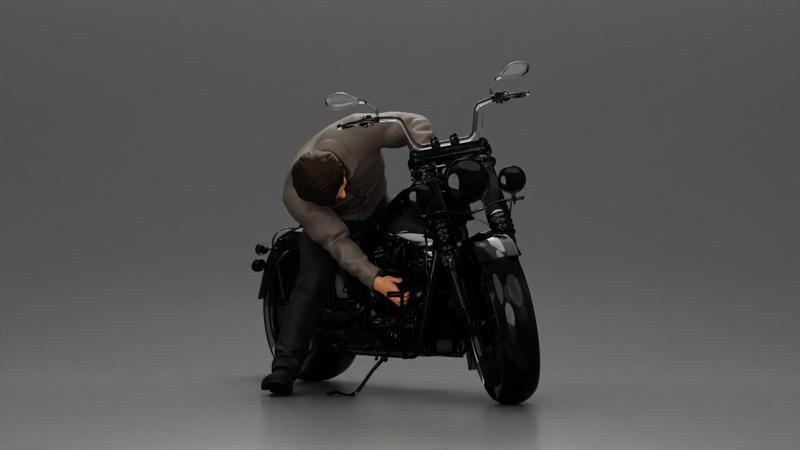 Man sitting on a vintage motorcycle, checking it for restoration