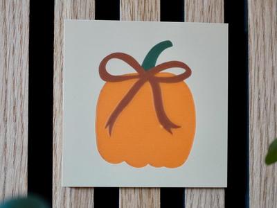 Tile with pumpkin and bow