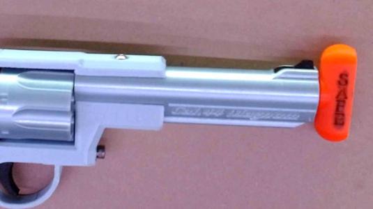 Gun barrel safety plug for prop guns