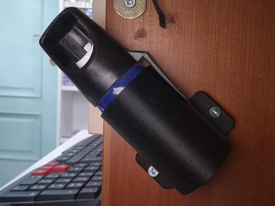 Wall-mounted pepper spray holder