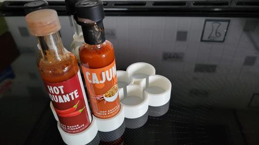 Support for hot sauce in fridge
