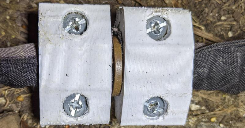 Bracket for fabric soaker hoses