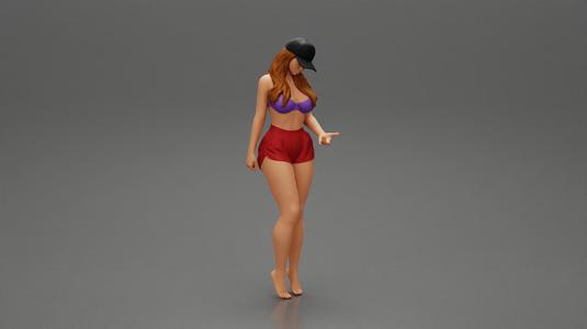 Sexy Girl standing in Cap and Shorts With Posing