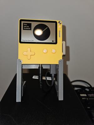 Playdate stand with space for headphone and usb plug