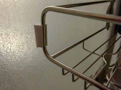 Rack bumper for SimpleHuman over-door shower caddy