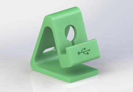 Phone stand with reversible charge cable