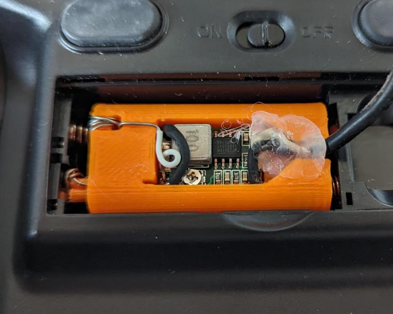 Power supply to 2 AAA batteries adaptor with buck converter