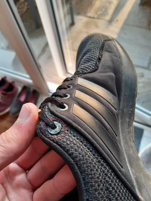 Two part shoelace eyelet