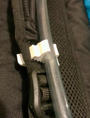 Clip for trail running hydration tube