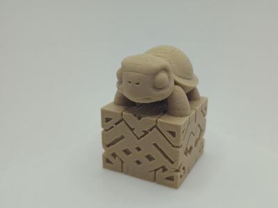 Turtle on an ornate base