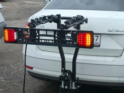 Number plate holder complete with lights
