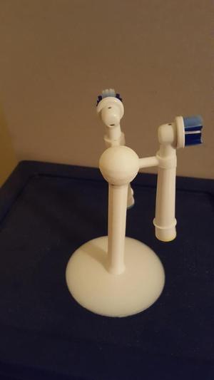 Electric toothbrush head holder