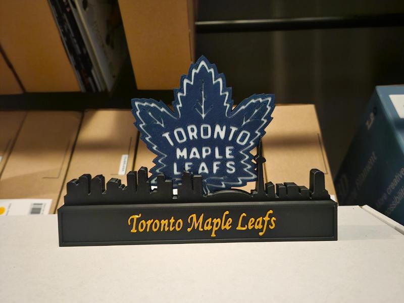 Toronto maple leafs with skyline of Toronto NHL