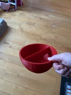 Egg cracking bowl with handle.