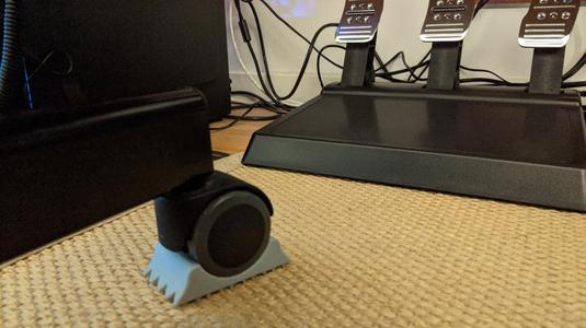 Carpet grip wheel chock for office chairs