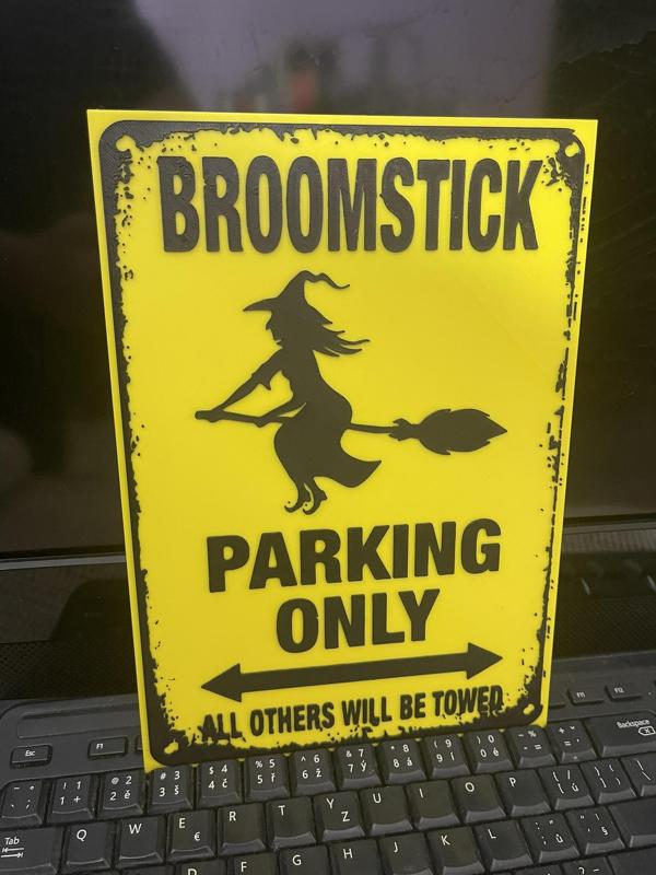 Broomstick parking sign