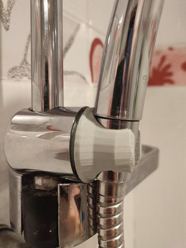 Part of a shower head holder