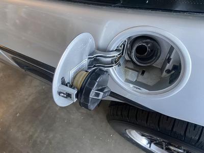 Fiero gas cap holder