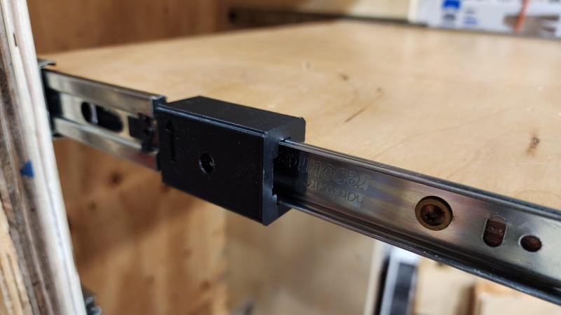 Jig for mounting drawer slides to shelves