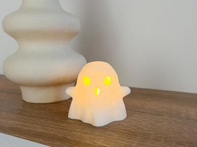 Ghost illuminated by LED candle for Halloween