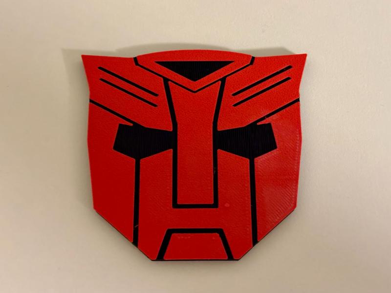Transformers Autobot over Tesla Emblem Logo Cover