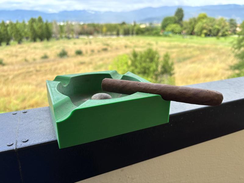 Ashtray with cigar holder and pipe emptyer