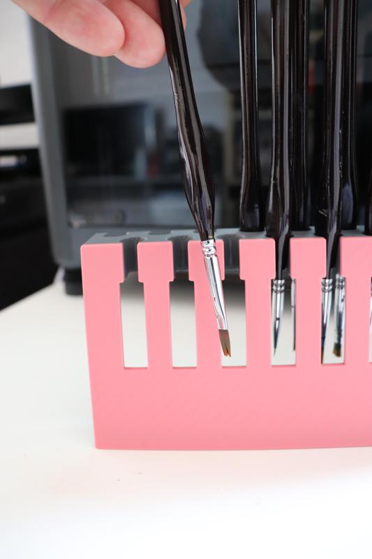 brush holder for ergonomic triangular handle